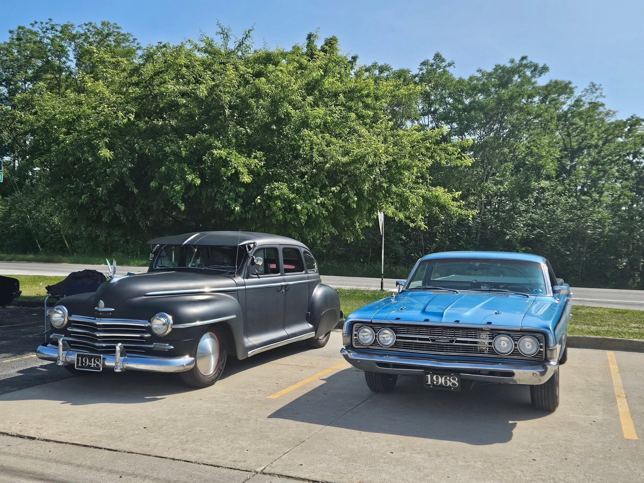 Classic car show vehicles outside Strikers Entertainment Center